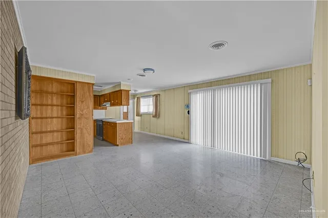 a view of a room with cabinet and mirrors