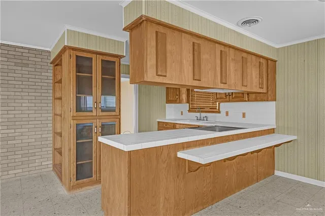 a kitchen with stainless steel appliances granite countertop a sink and cabinets