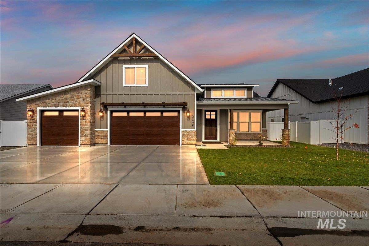 3145 Moonrise Road Twin Falls, ID 83301 - Photo 1 of 1 View of front of home with board and batten siding, a porch, concrete driveway, and stone siding