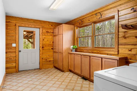a view of walk in closet with empty room