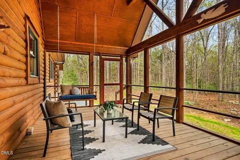 a view of a chairs and table on the wooden floor