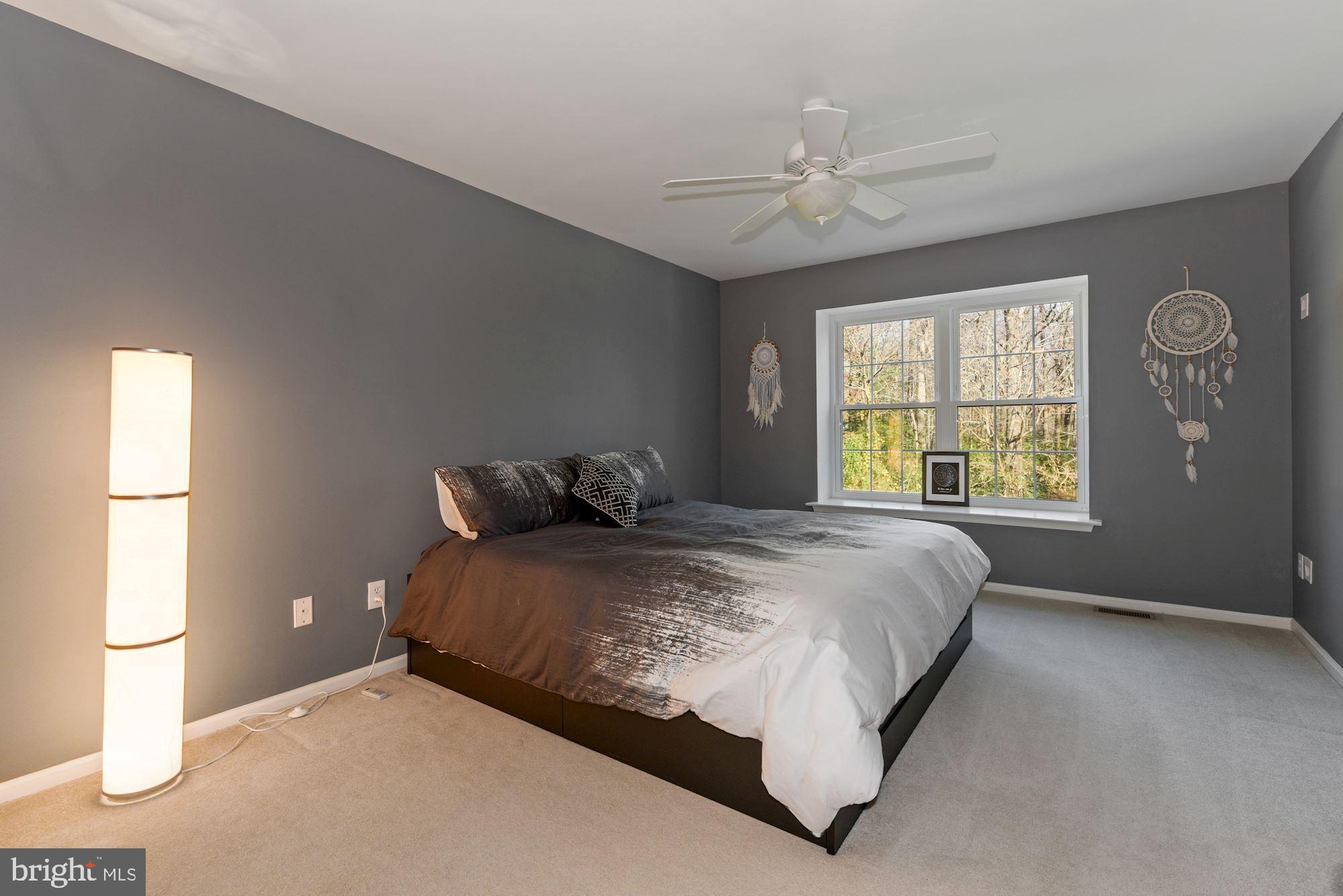 40 Stokes Road Mount Laurel, NJ 08054 - Photo 14 of 28 a bed sitting in a bedroom next to a window