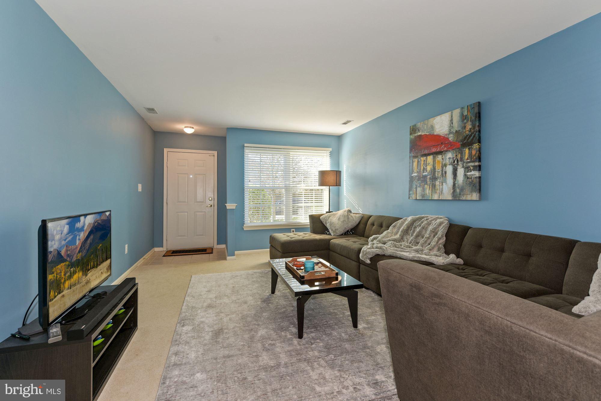 40 Stokes Road Mount Laurel, NJ 08054 - Photo 8 of 28 a living room with furniture and a flat screen tv