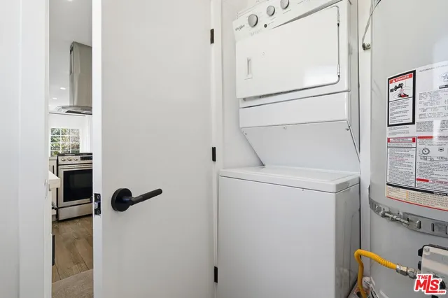 a bathroom with a refrigerator and a sink