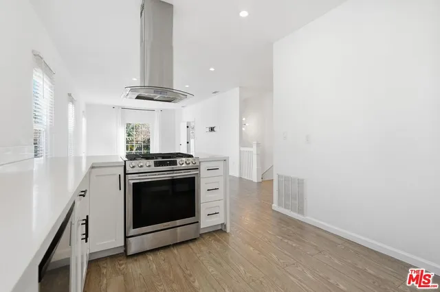a kitchen with a stove and a microwave