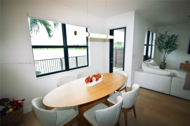 a outdoor dining room with furniture and window