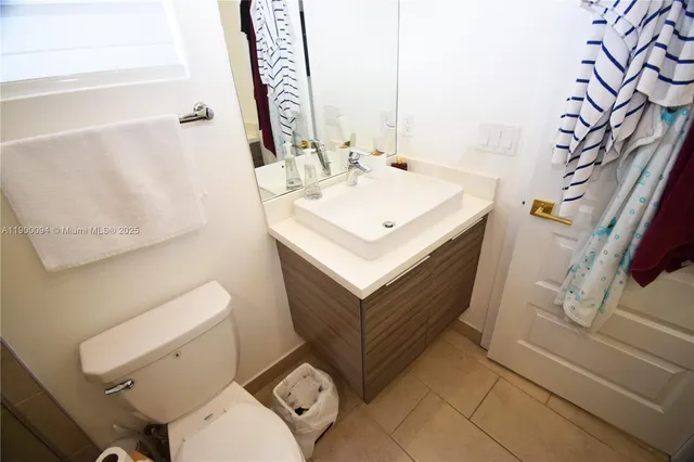 a bedroom with bed and window