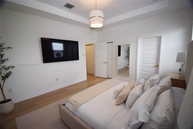a bathroom with a sink a toilet and shower curtain