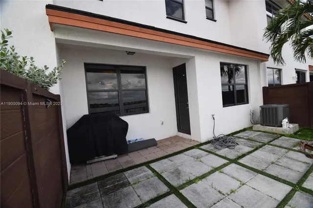 a balcony with view of the house