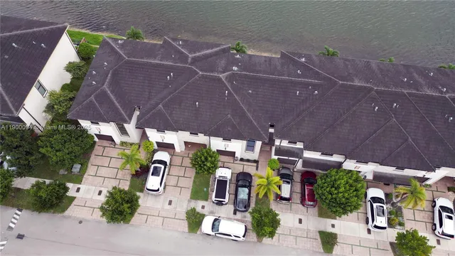 a couple of table and chairs in front of a house