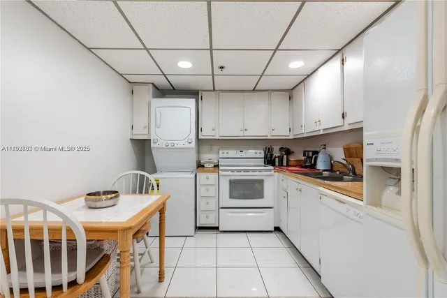 a kitchen with cabinets a sink and appliances
