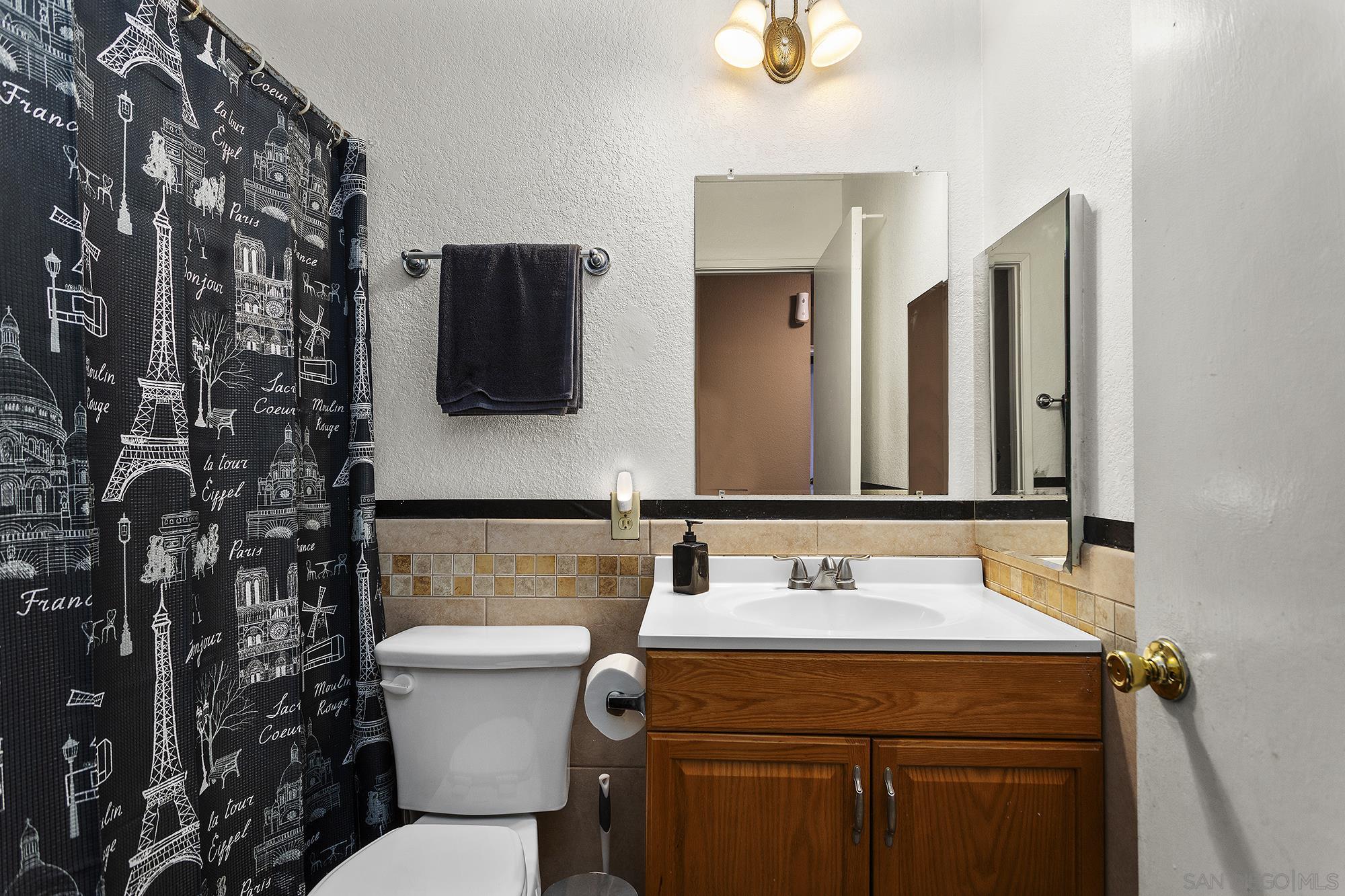 2810 Rosedale Place Spring Valley, CA 91977 - Photo 20 of 48 a bathroom with a sink and a toilet