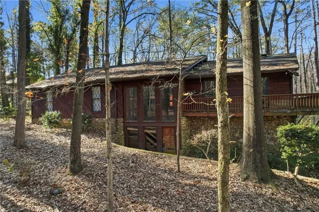 a view of a house with a yard and balcony