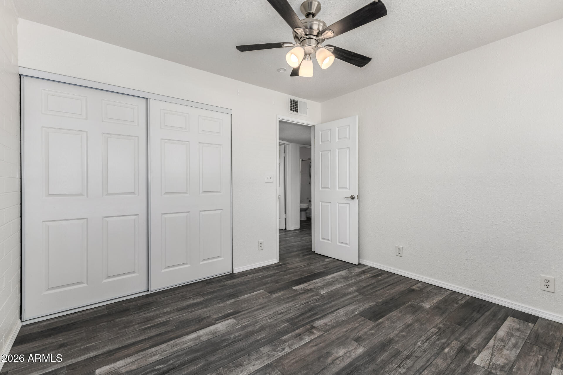 801 East Ruth Avenue Phoenix, AZ 85020 - Photo 20 of 35 an empty room with wooden floor closet and windows