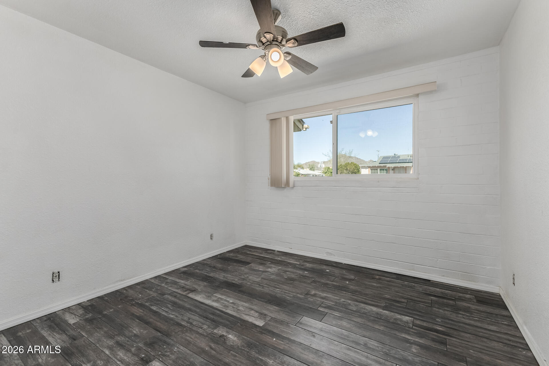 801 East Ruth Avenue Phoenix, AZ 85020 - Photo 21 of 35 wooden floor in an empty room with a window