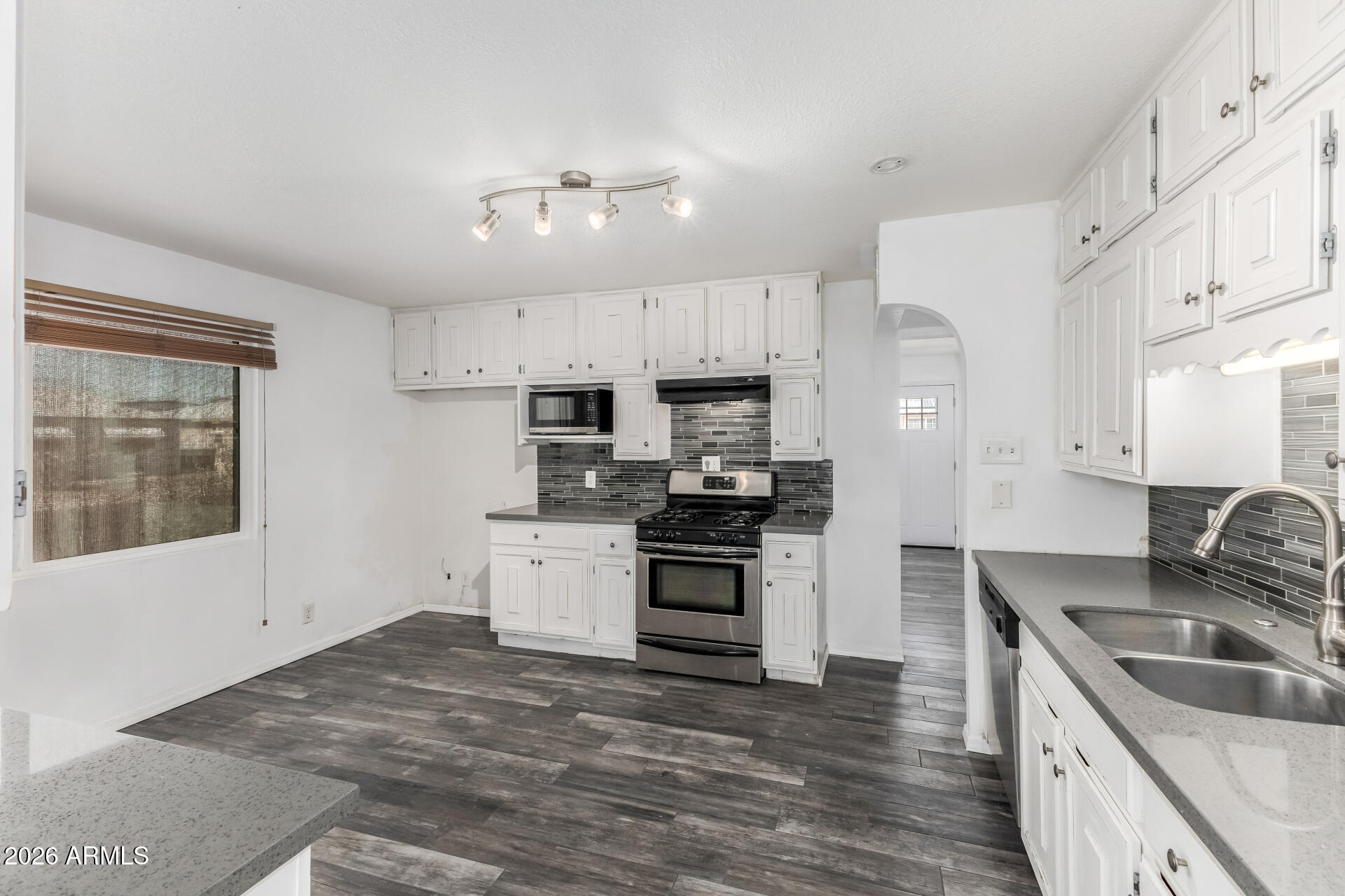 801 East Ruth Avenue Phoenix, AZ 85020 - Photo 5 of 35 a kitchen with granite countertop a sink stainless steel appliances and cabinets