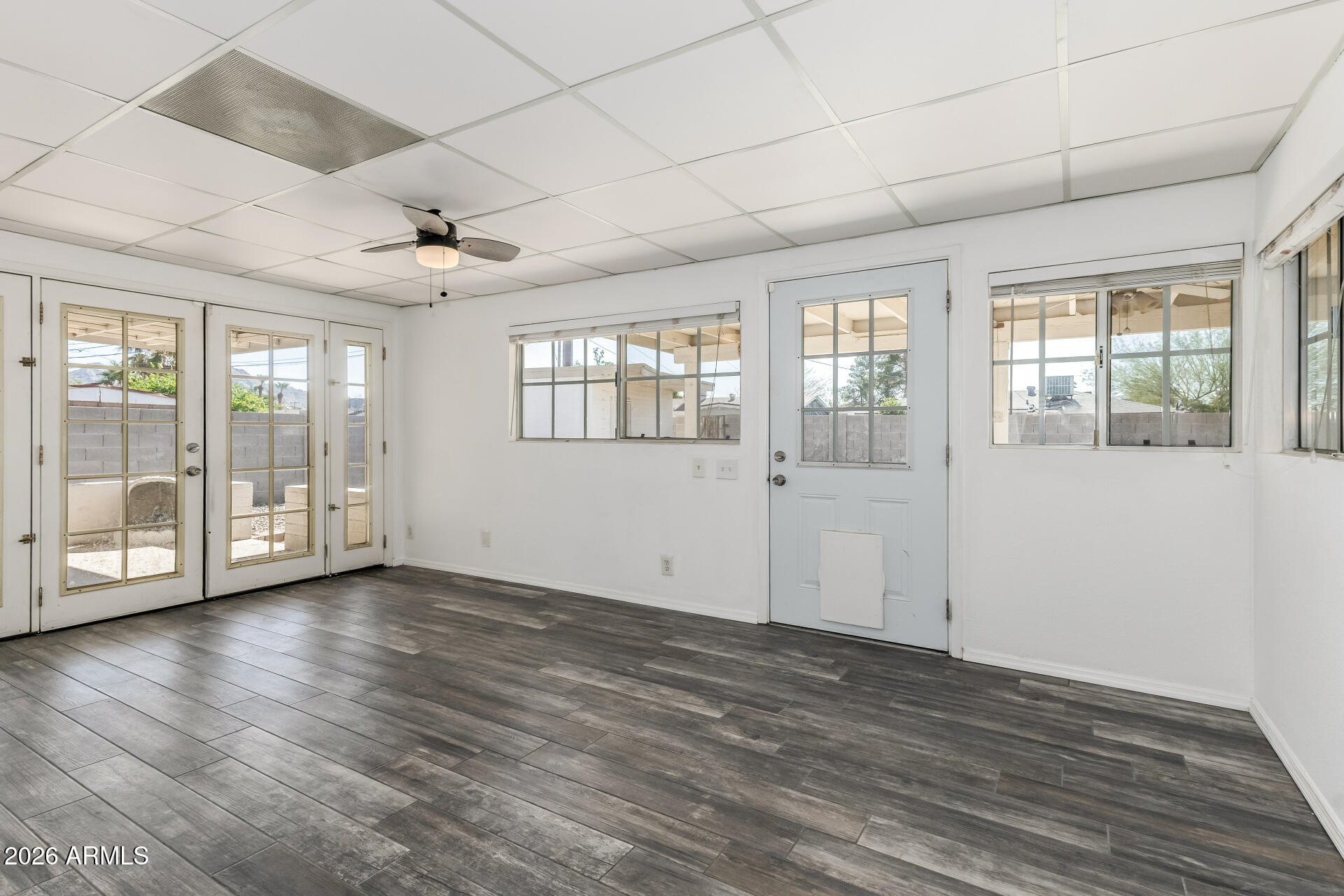 801 East Ruth Avenue Phoenix, AZ 85020 - Photo 9 of 35 a view of an empty room with wooden floor and a window