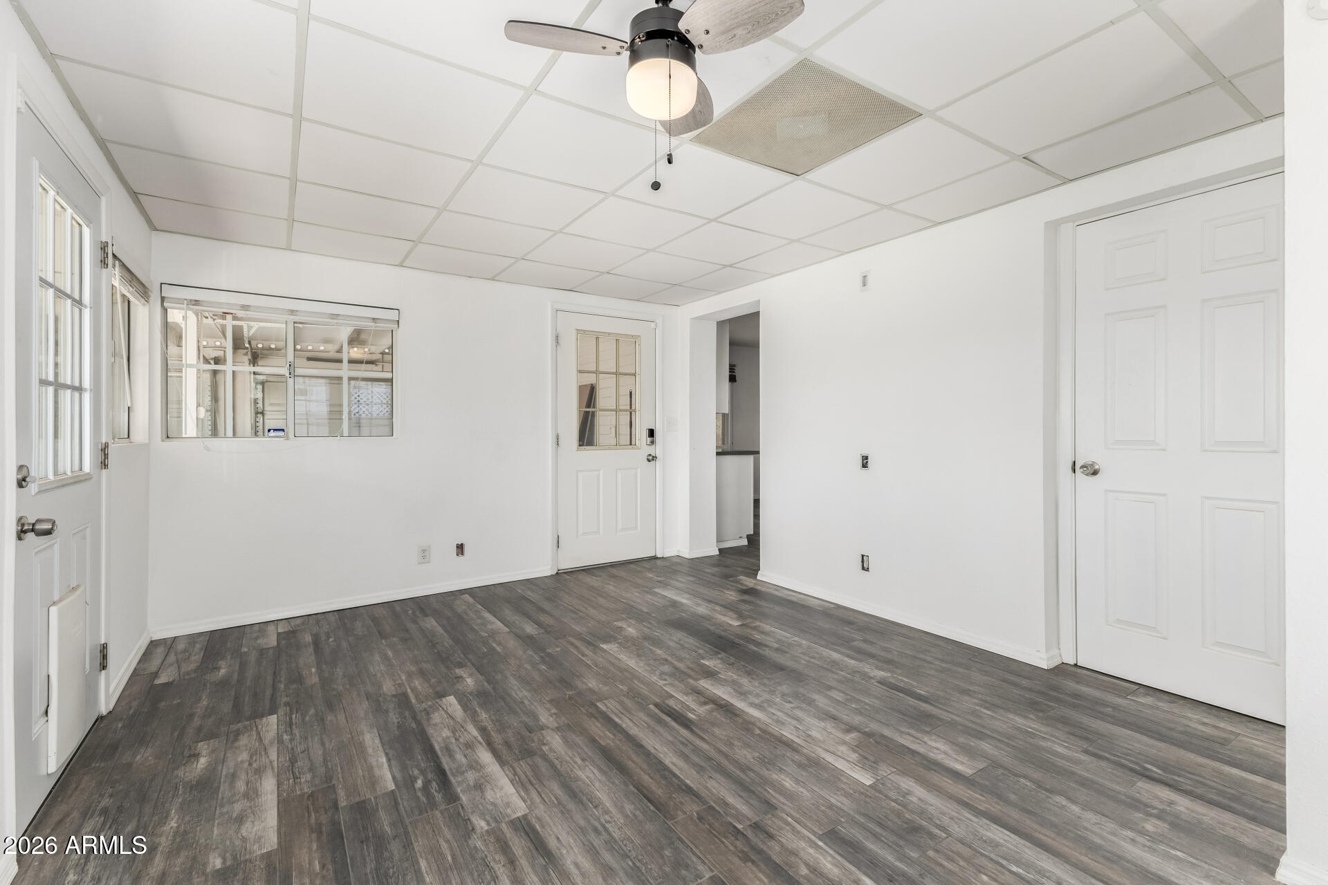 801 East Ruth Avenue Phoenix, AZ 85020 - Photo 10 of 35 a view of empty room with wooden floor and ceiling fan