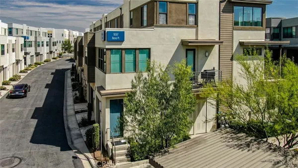 an aerial view of a multi story parking building
