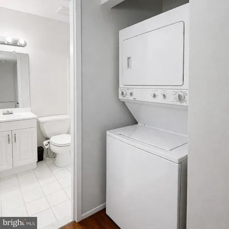 a view of bathroom with a toilet and a sink