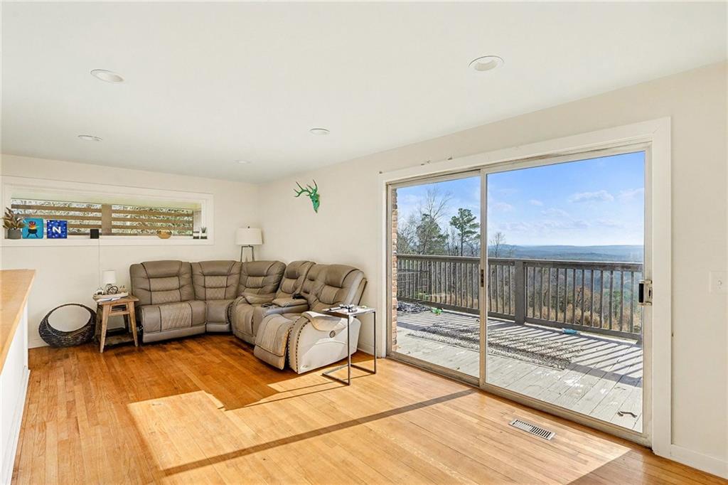 6900 Scenic Heights Road Manchester, GA 31816 - Photo 13 of 30 a living room with furniture and a floor to ceiling window
