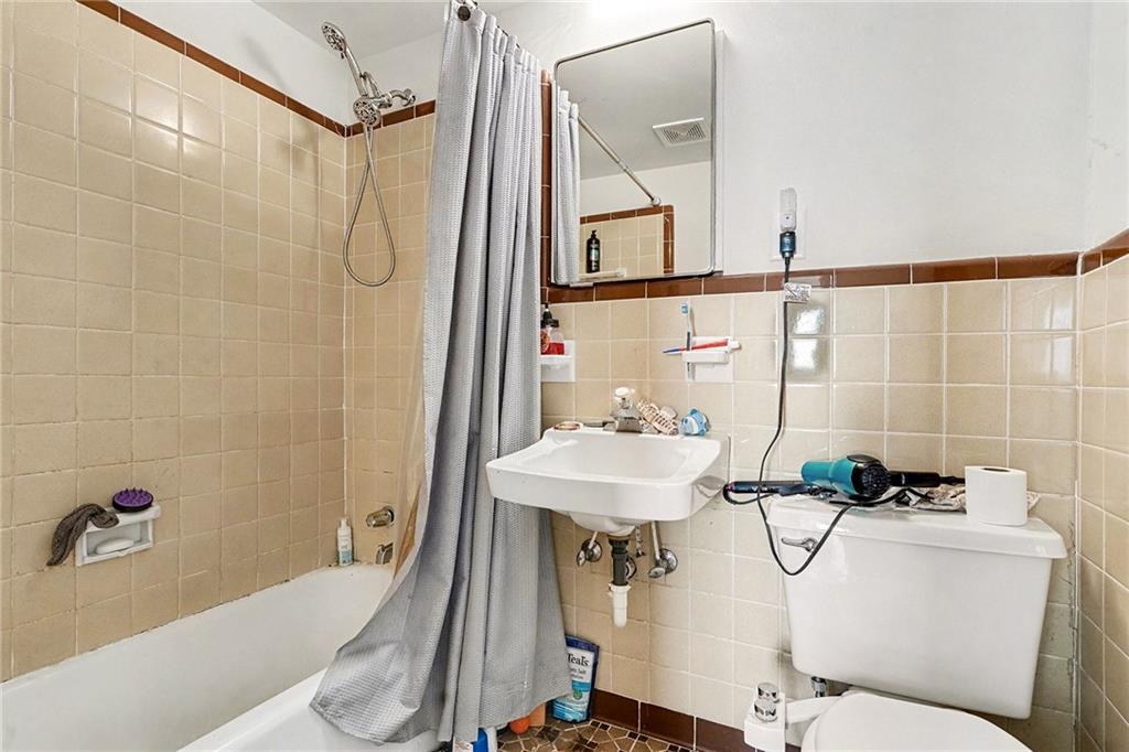 6900 Scenic Heights Road Manchester, GA 31816 - Photo 16 of 30 a bathroom with a sink a toilet a mirror and shower