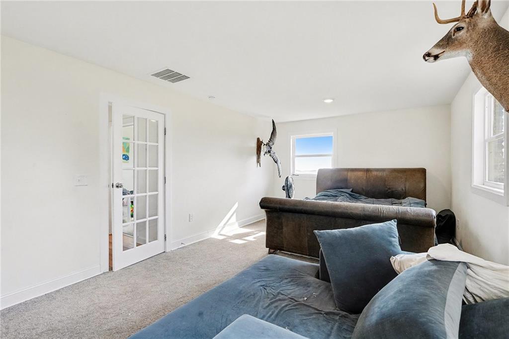 6900 Scenic Heights Road Manchester, GA 31816 - Photo 22 of 30 a living room with a couch and a window