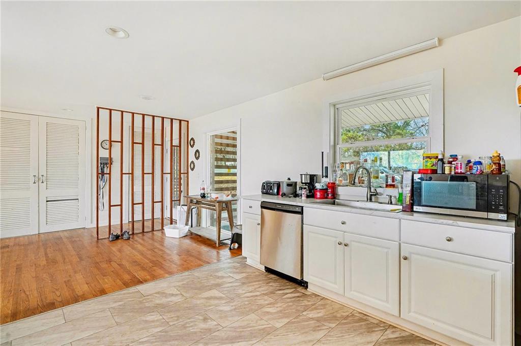6900 Scenic Heights Road Manchester, GA 31816 - Photo 9 of 30 a kitchen with a sink cabinets and wooden floor
