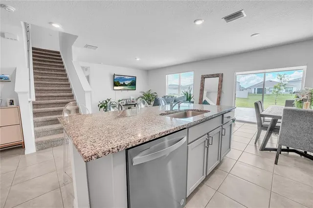a view of kitchen with furniture wooden floor and window