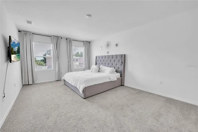 a bedroom with furniture and a couch