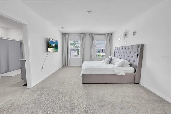 a bedroom with a bed and a table in it