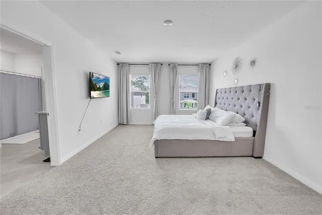 a bedroom with a bed and a table in it