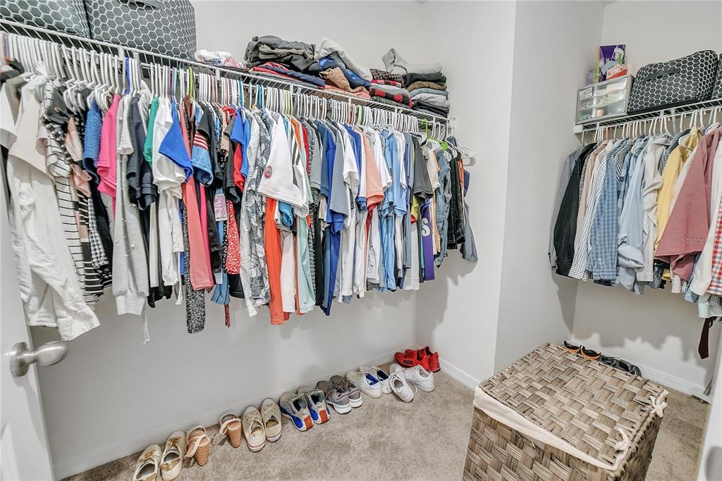 8237 Juning Cove Wesley Chapel, FL 33545 - Photo 37 of 59 a view of walk in closet with clothes