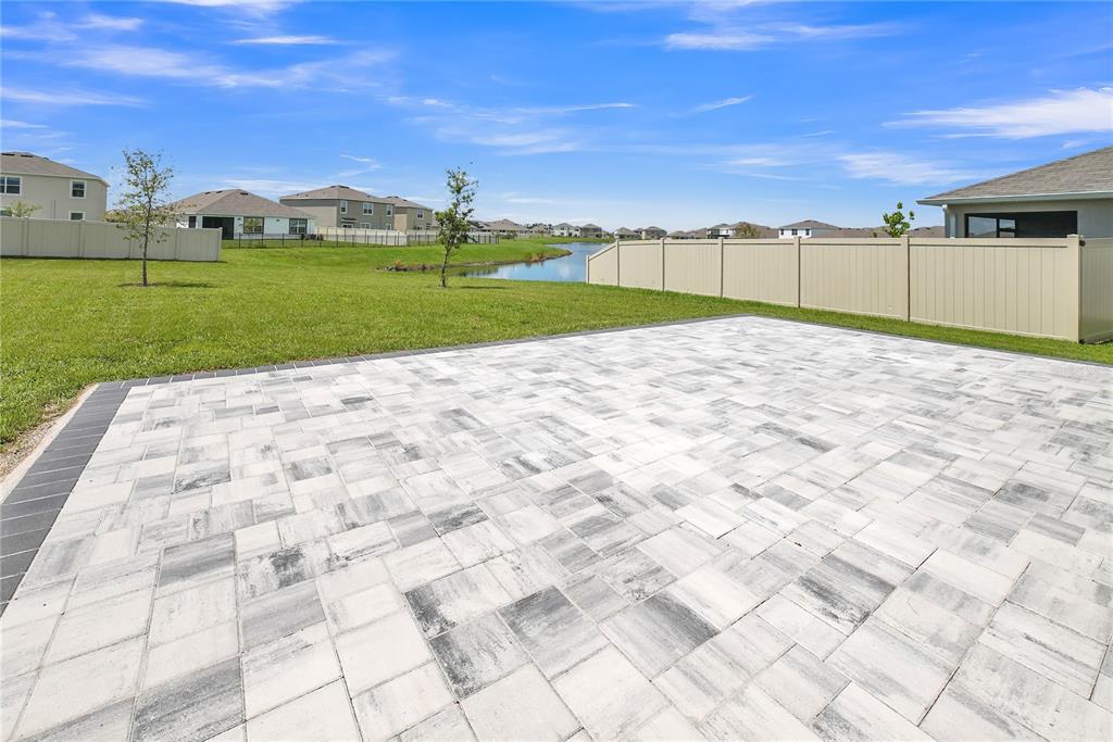 8237 Juning Cove Wesley Chapel, FL 33545 - Photo 52 of 59 a view of a big yard with a house