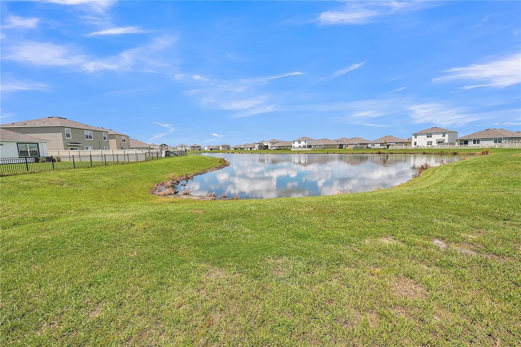 8237 Juning Cove Wesley Chapel, FL 33545 - Photo 55 of 59 a view of lake with houses