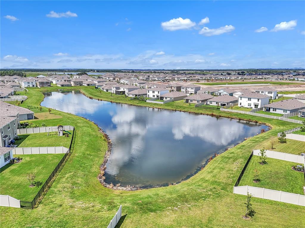 8237 Juning Cove Wesley Chapel, FL 33545 - Photo 57 of 59 a view of a lake with a outdoor space