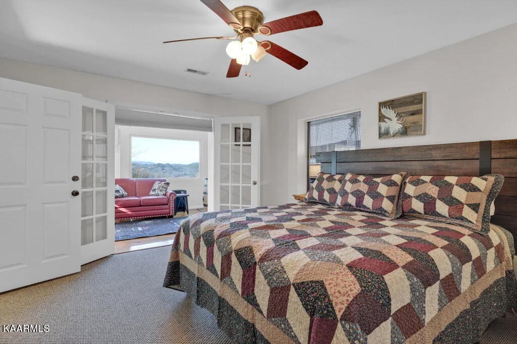 3514 Jakes Ridge Sevierville, TN 37862 - Photo 13 of 28 a bedroom with a bed and wooden floor