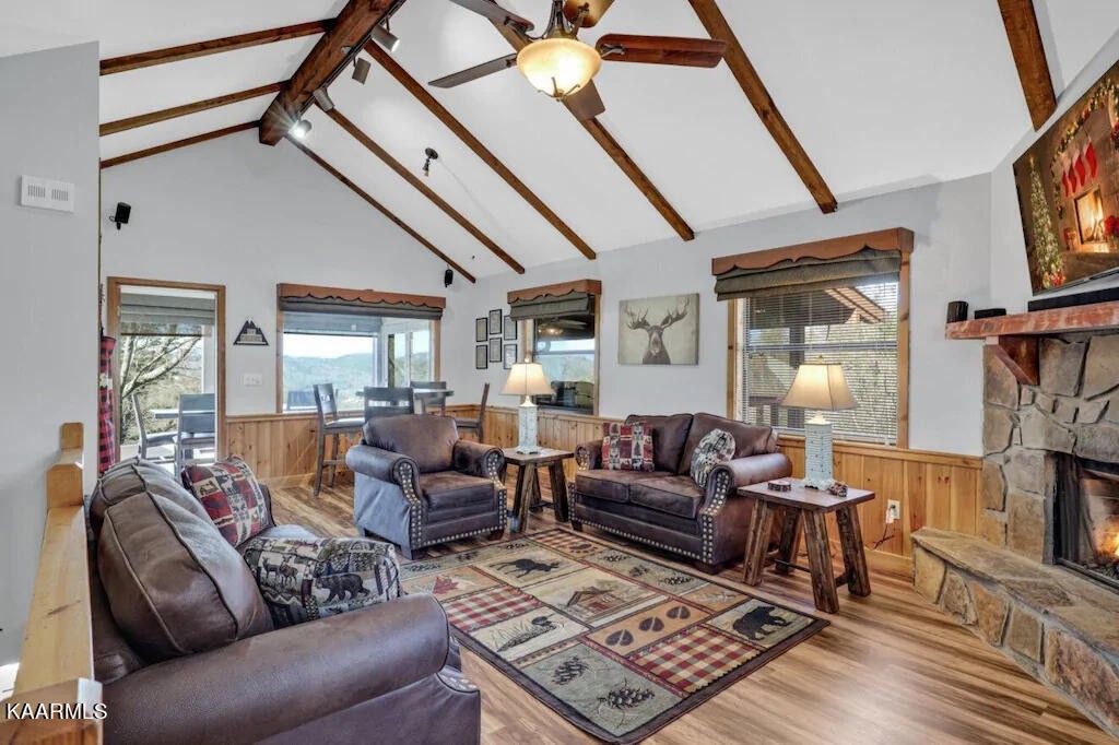 3514 Jakes Ridge Sevierville, TN 37862 - Photo 3 of 28 a living room with furniture a fireplace and a flat screen tv