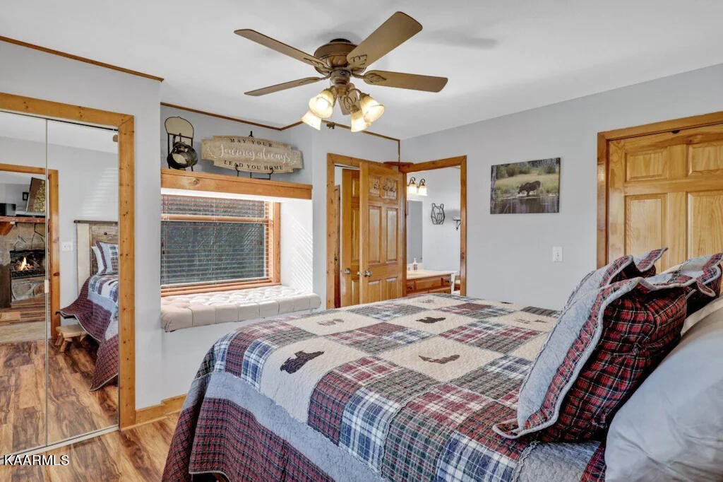 3514 Jakes Ridge Sevierville, TN 37862 - Photo 6 of 28 a bedroom with a bed and a chandelier