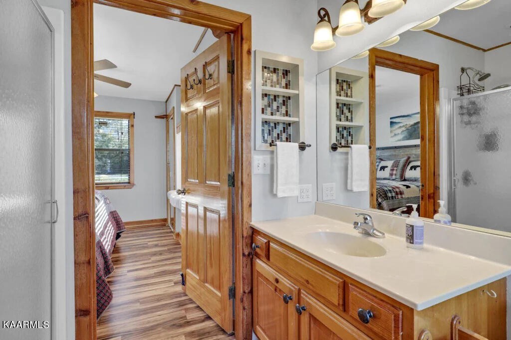 3514 Jakes Ridge Sevierville, TN 37862 - Photo 7 of 28 a bathroom with a sink a mirror and a shower