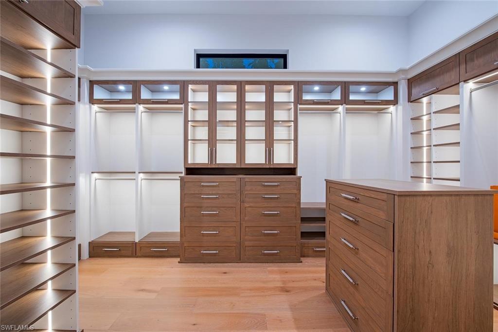 1456 Curlew Avenue Naples, FL 34102 - Photo 17 of 38 a view of walk in closet with clothes