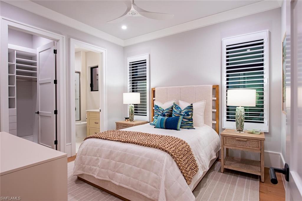 1456 Curlew Avenue Naples, FL 34102 - Photo 19 of 38 a bedroom with a bed and a window