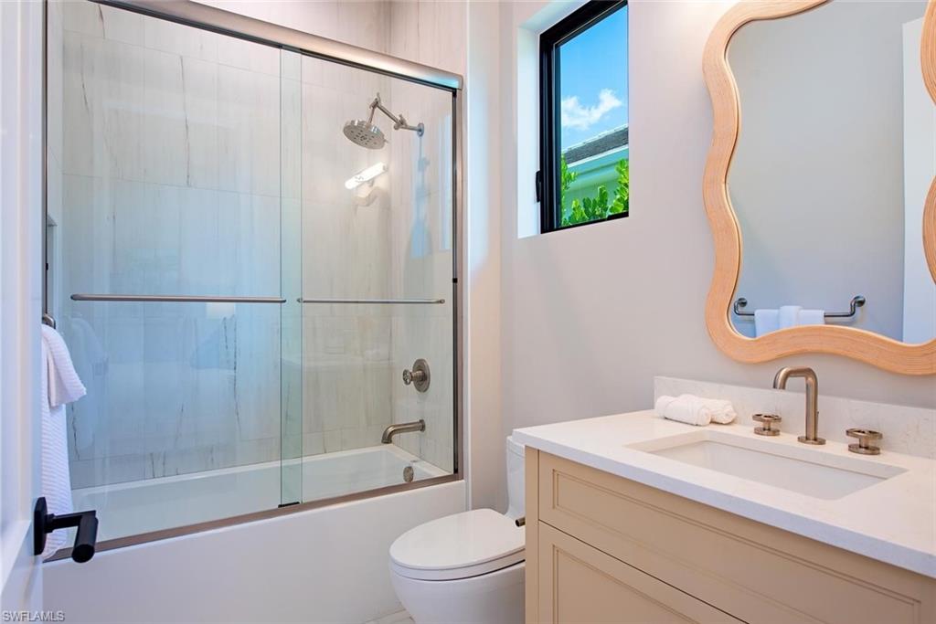 1456 Curlew Avenue Naples, FL 34102 - Photo 20 of 38 a bathroom with a sink toilet and shower