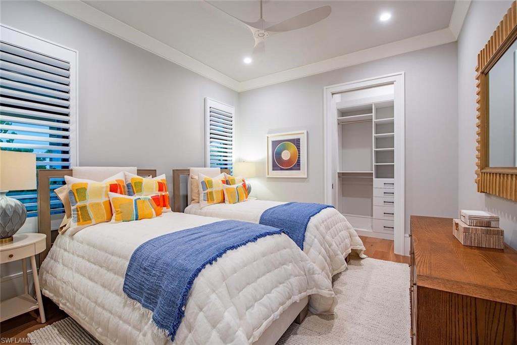 1456 Curlew Avenue Naples, FL 34102 - Photo 23 of 38 a bedroom with bed and a window