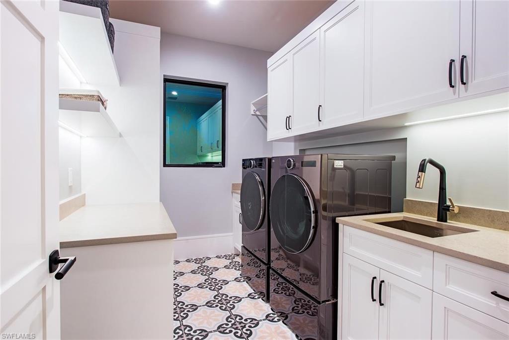 1456 Curlew Avenue Naples, FL 34102 - Photo 25 of 38 a utility room with sink dryer and washer