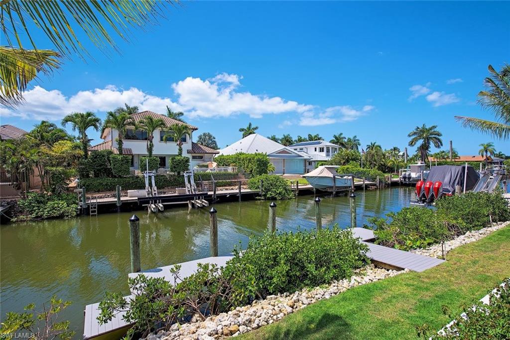 1456 Curlew Avenue Naples, FL 34102 - Photo 32 of 38 a view of a lake with houses