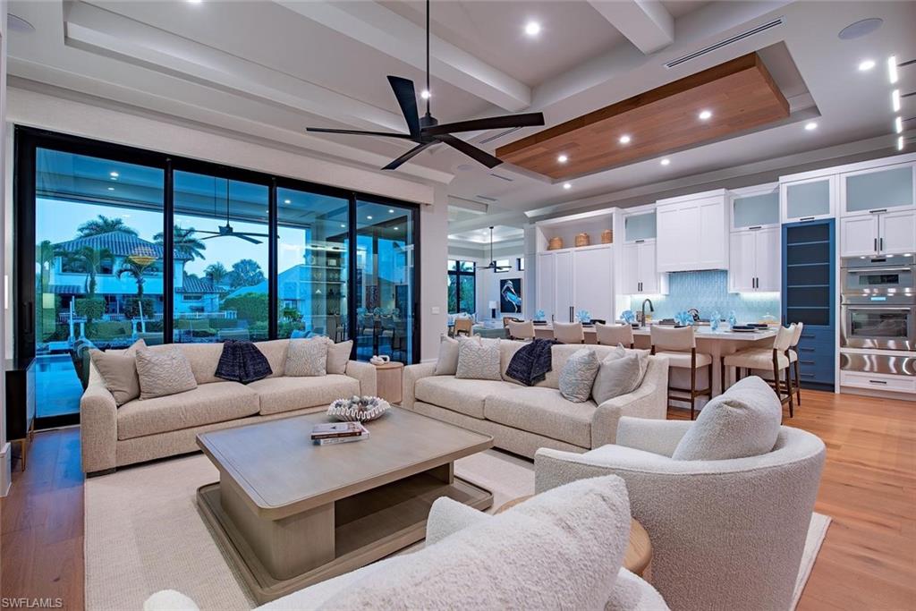 1456 Curlew Avenue Naples, FL 34102 - Photo 4 of 38 a living room with furniture and a large window