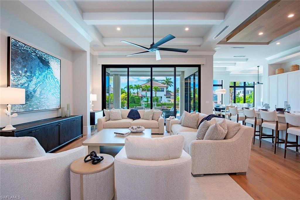 1456 Curlew Avenue Naples, FL 34102 - Photo 5 of 38 a living room with furniture and a large window