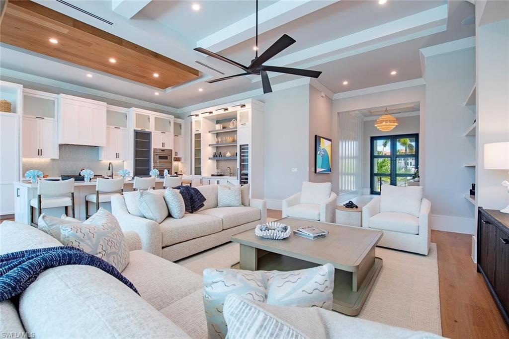 1456 Curlew Avenue Naples, FL 34102 - Photo 6 of 38 a living room with furniture and a large window