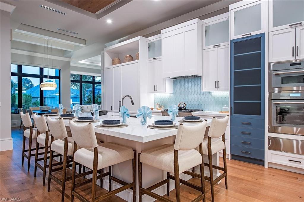 1456 Curlew Avenue Naples, FL 34102 - Photo 10 of 38 a dining room with furniture and wooden floor